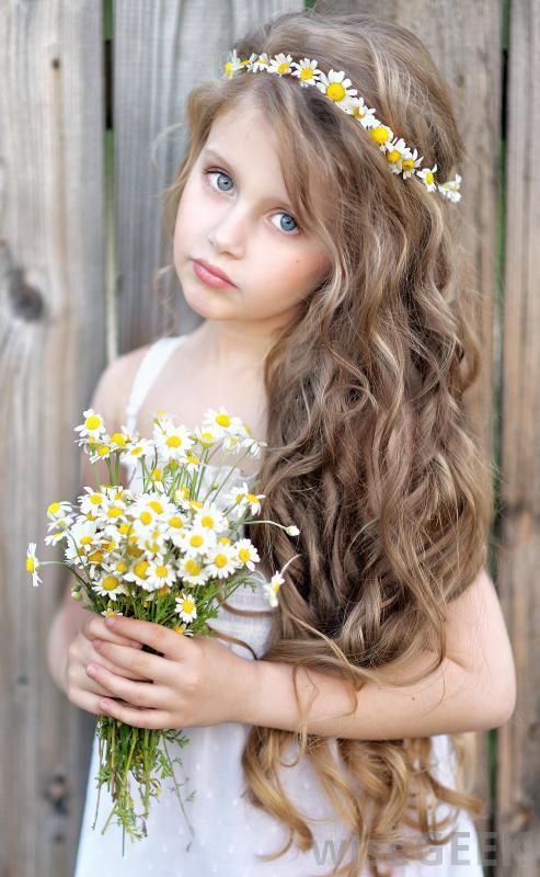 young-girl-carrying-flowers-in-white-dress.jpg