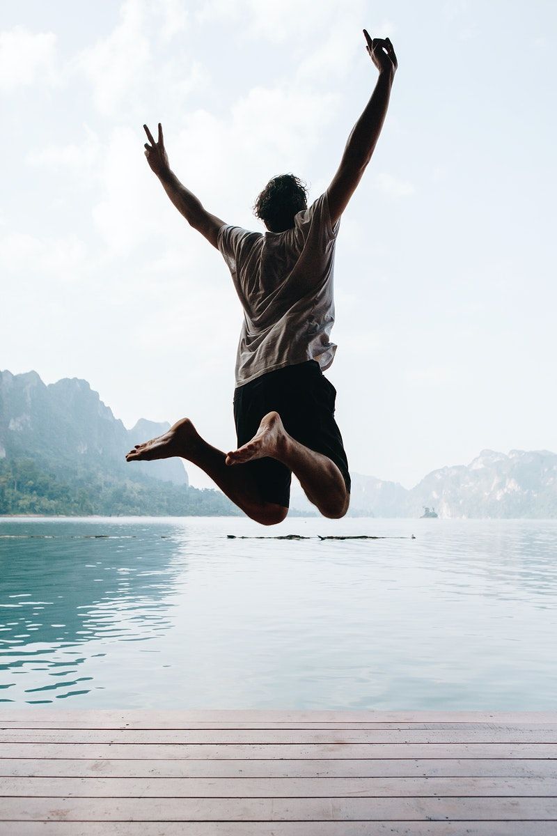 Download premium image of Happy man jumping with joy by McKinsey  about jump, excited man, river, alone, and american 412305.jpg